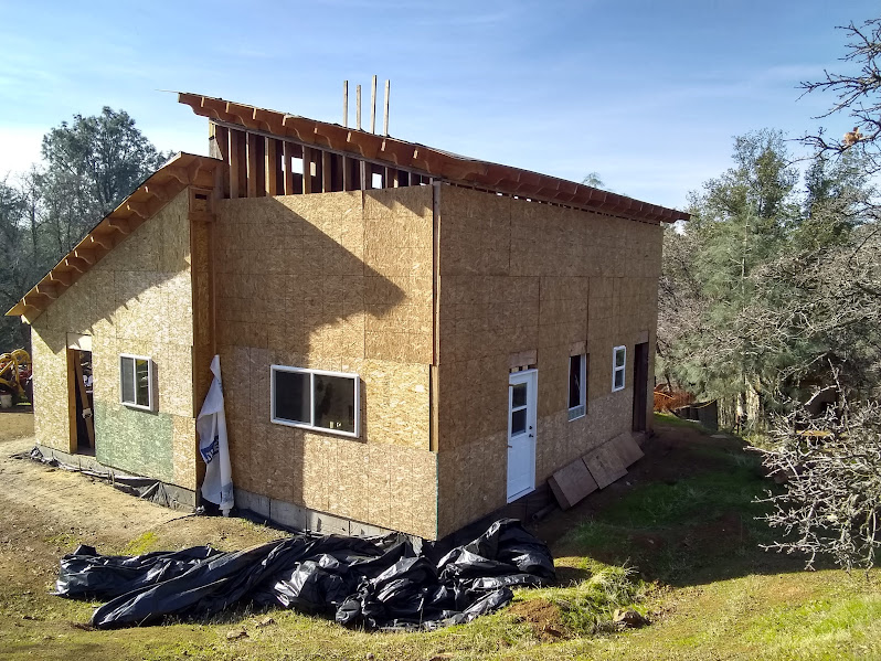 Exterior envelope nearing completion with weather-in progress